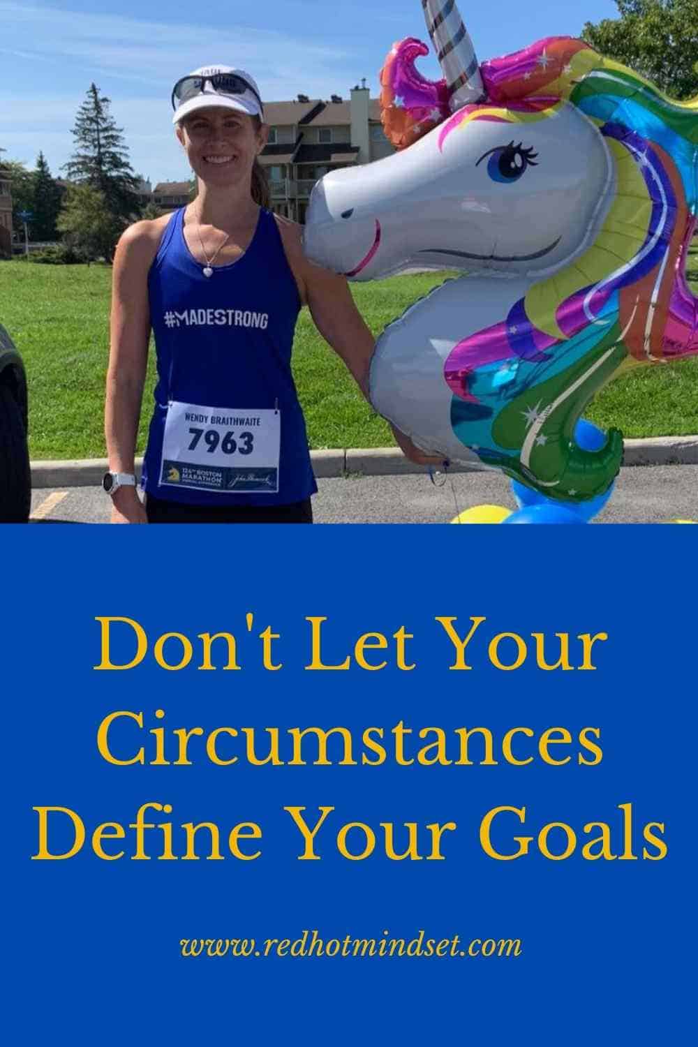 Woman smiling with her hair pulled back and a white visor wearing a blue tank and holding a colorful unicorn balloon after finishing a running race