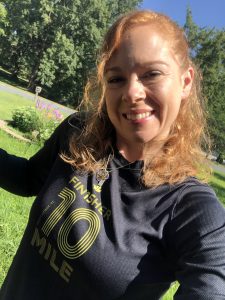 Gabe Cox smiling at the camera while wearing a Finisher running shirt